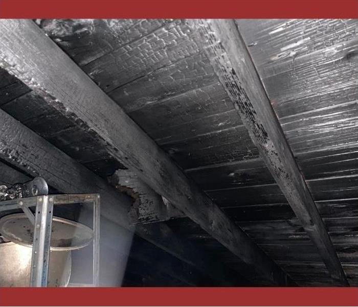 The inside of the roof in a Saratoga attic heavily burned and charred.