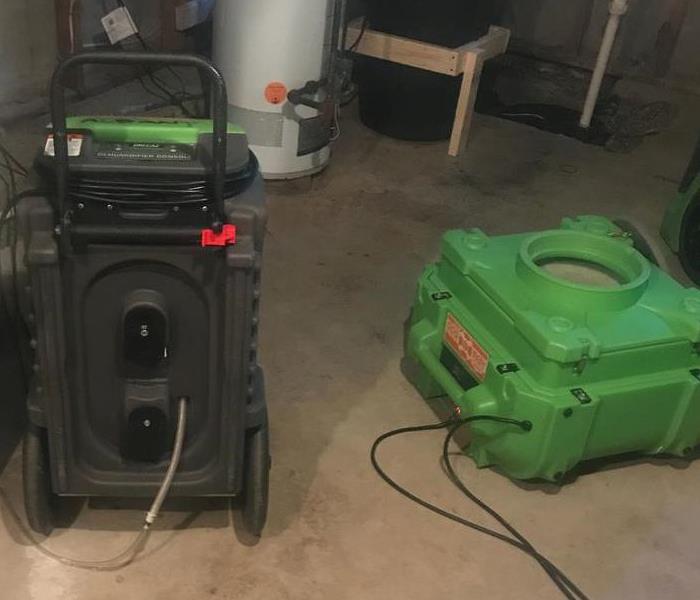 Cleaning the wet basement with our SERVPRO equipment.
