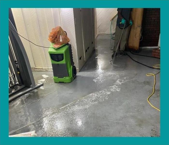 We power-hosed the basement floor and then used our powerful vacuums to dry it.