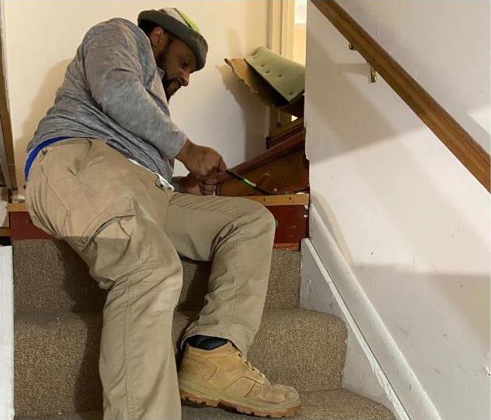 One of our technicians removing the carpet from a staircase in a Saratoga home.