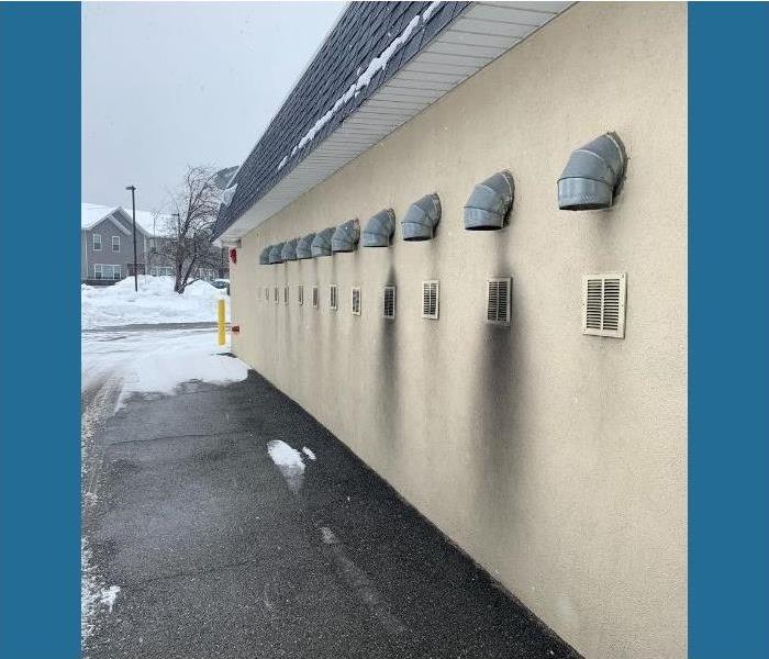 Soot stained the outside of this Saratoga laundromat after a fire.