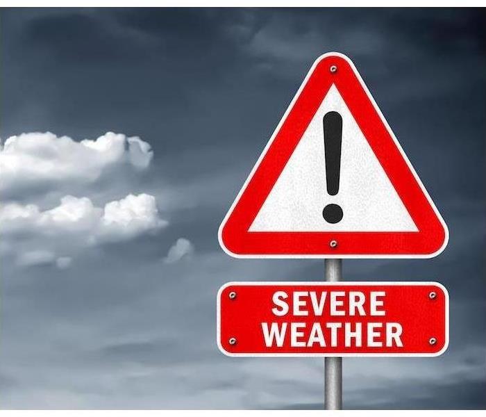 A red and white sign with an explanation point that reads "Severe Weather"